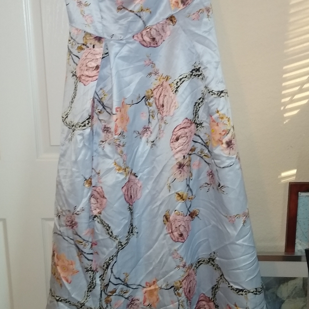 Never worn!  One shoulder floral dress